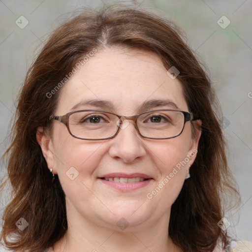 Joyful white adult female with medium  brown hair and blue eyes