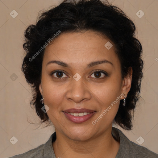 Joyful latino adult female with medium  brown hair and brown eyes