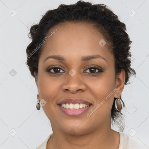 Joyful black young-adult female with long  brown hair and brown eyes