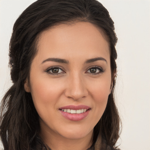 Joyful white young-adult female with long  brown hair and brown eyes