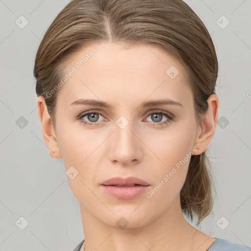 Neutral white young-adult female with medium  brown hair and grey eyes