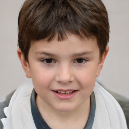 Joyful white child male with short  brown hair and brown eyes