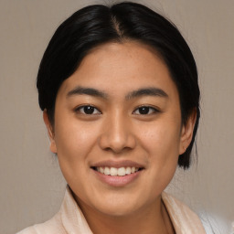 Joyful asian young-adult female with medium  black hair and brown eyes