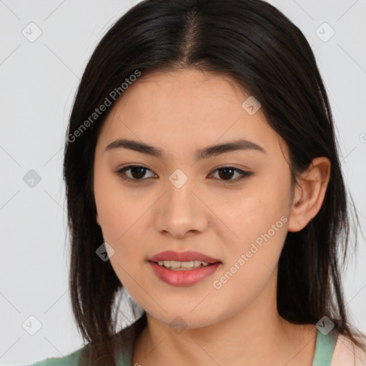 Joyful asian young-adult female with long  brown hair and brown eyes