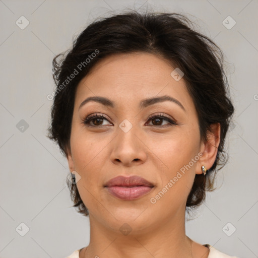 Joyful asian adult female with medium  brown hair and brown eyes