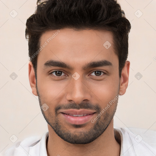 Joyful white young-adult male with short  black hair and brown eyes