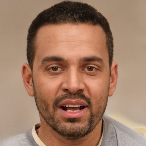 Joyful white adult male with short  brown hair and brown eyes