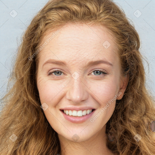 Joyful white young-adult female with long  brown hair and green eyes