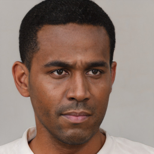Neutral latino young-adult male with short  brown hair and brown eyes