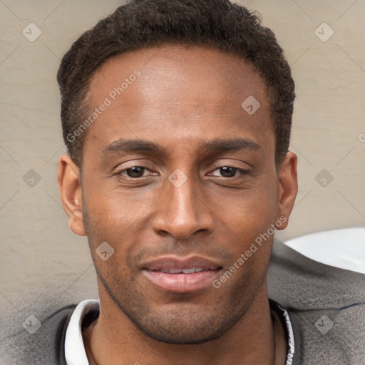 Joyful black young-adult male with short  brown hair and brown eyes