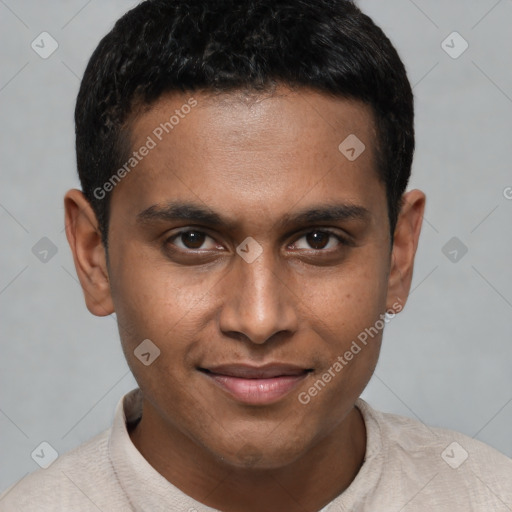 Joyful black young-adult male with short  brown hair and brown eyes