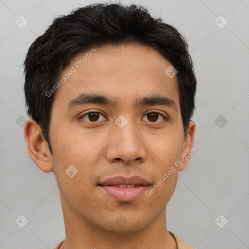 Joyful asian young-adult male with short  brown hair and brown eyes