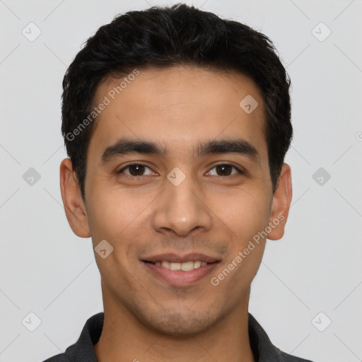 Joyful latino young-adult male with short  black hair and brown eyes