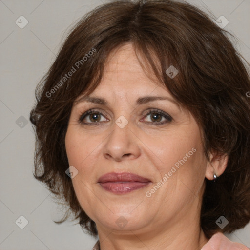 Joyful white adult female with medium  brown hair and brown eyes