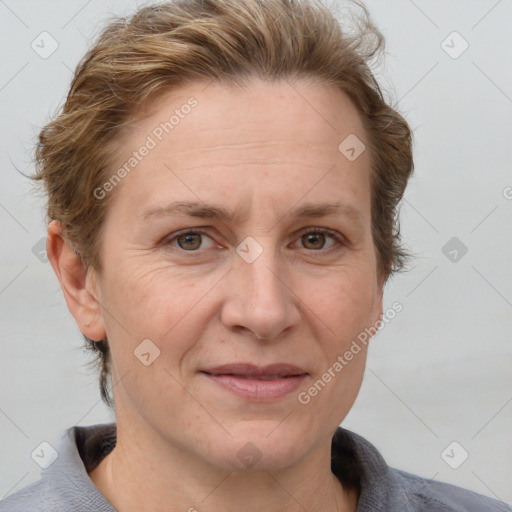 Joyful white adult female with short  brown hair and grey eyes