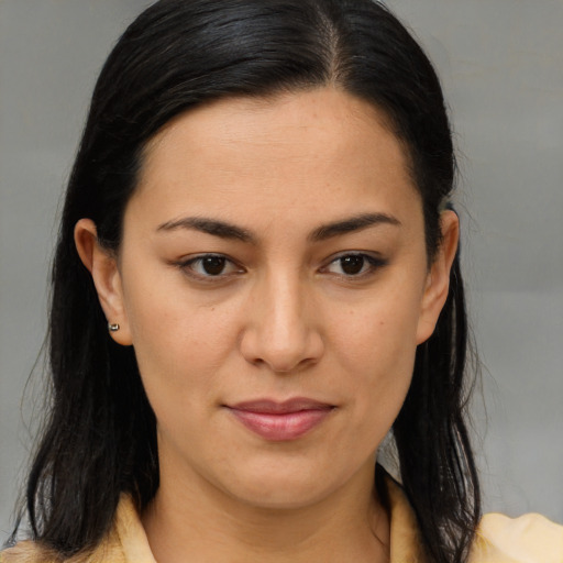 Joyful latino young-adult female with medium  brown hair and brown eyes