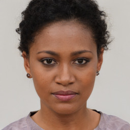 Neutral black young-adult female with short  brown hair and brown eyes