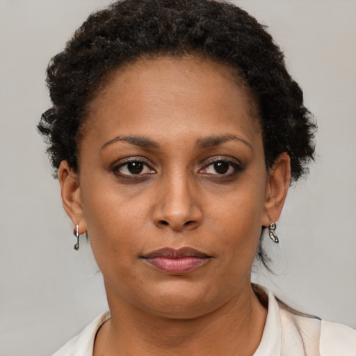 Neutral black adult female with short  brown hair and brown eyes