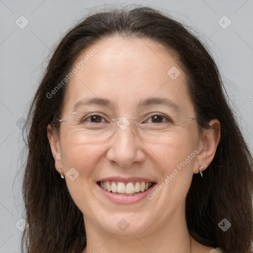 Joyful white adult female with long  brown hair and brown eyes