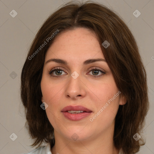 Joyful white young-adult female with medium  brown hair and green eyes