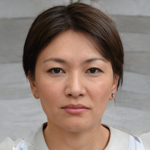 Neutral white young-adult female with short  brown hair and brown eyes