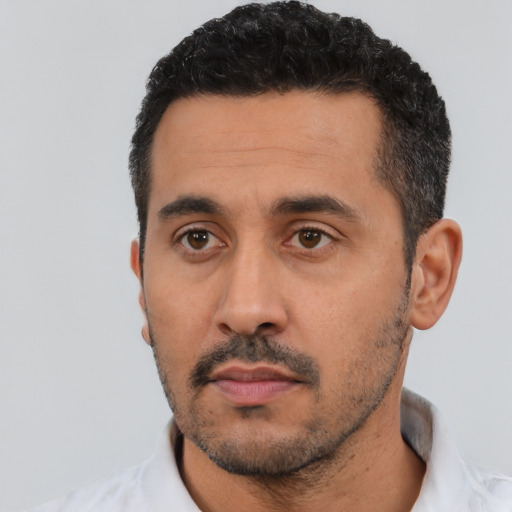 Neutral latino young-adult male with short  black hair and brown eyes