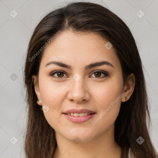 Joyful white young-adult female with long  brown hair and brown eyes