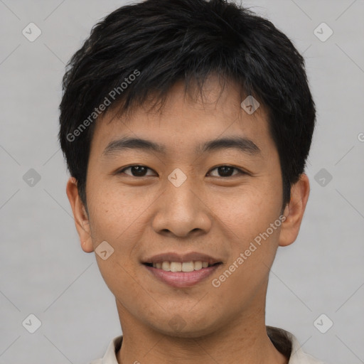 Joyful asian young-adult male with short  brown hair and brown eyes