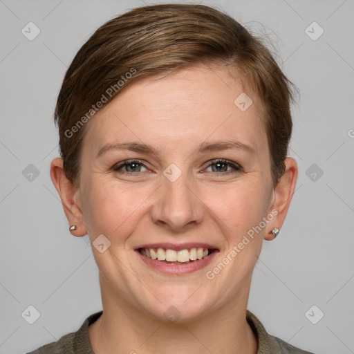 Joyful white young-adult female with short  brown hair and grey eyes