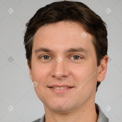 Joyful white young-adult male with short  brown hair and brown eyes