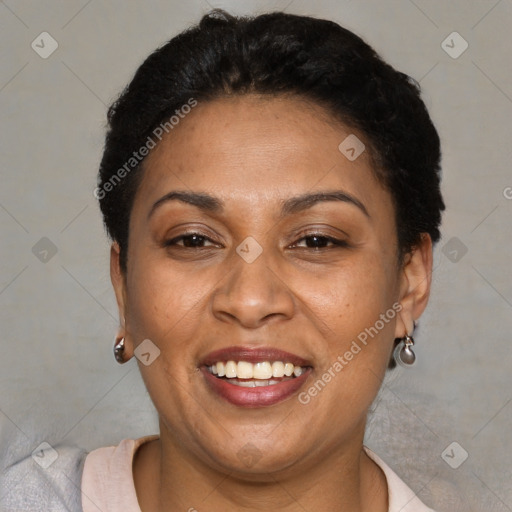 Joyful latino adult female with short  brown hair and brown eyes