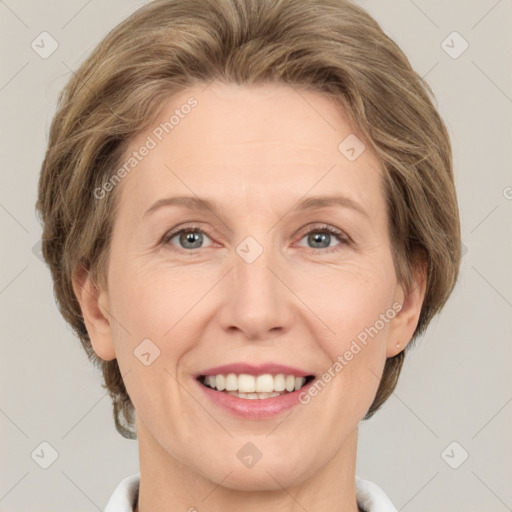 Joyful white adult female with medium  brown hair and grey eyes