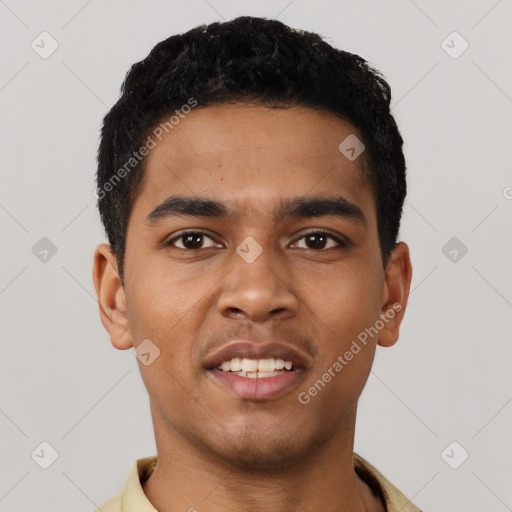 Joyful latino young-adult male with short  black hair and brown eyes