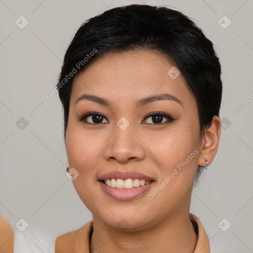 Joyful asian young-adult female with short  brown hair and brown eyes