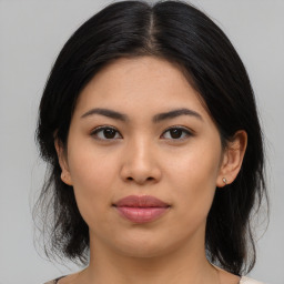 Joyful asian young-adult female with medium  brown hair and brown eyes