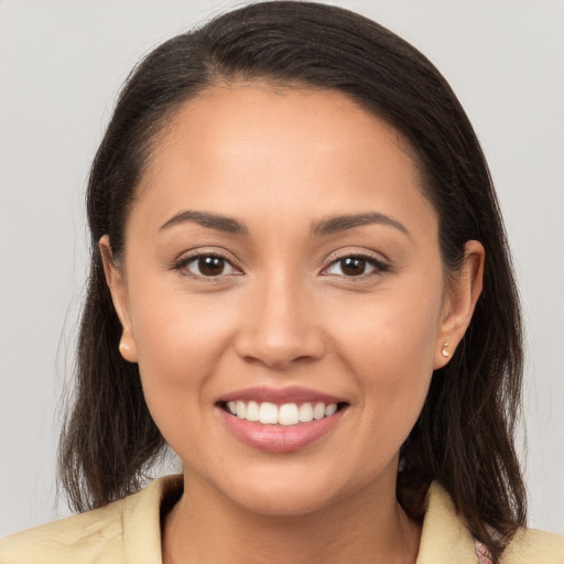 Joyful white young-adult female with long  brown hair and brown eyes