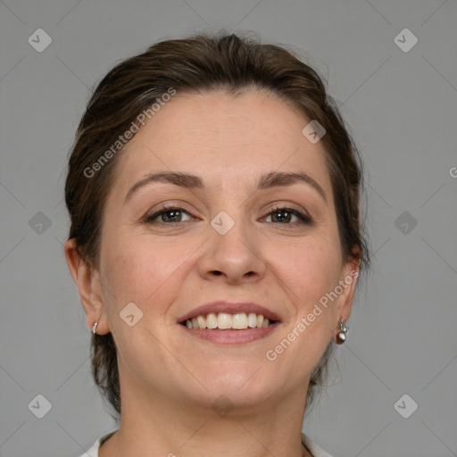 Joyful white adult female with medium  brown hair and grey eyes