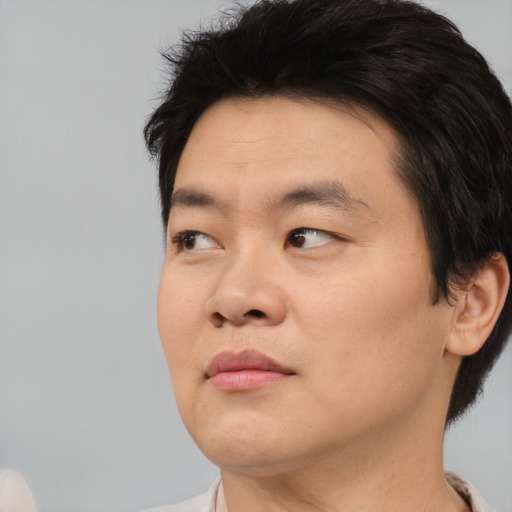 Neutral asian young-adult male with short  black hair and brown eyes