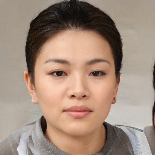 Neutral asian young-adult female with medium  brown hair and brown eyes