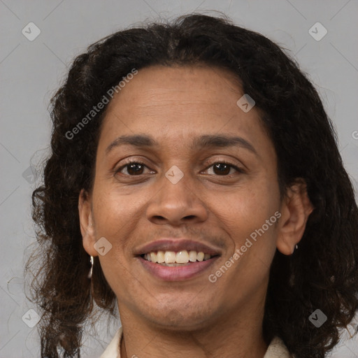 Joyful latino adult female with long  brown hair and brown eyes