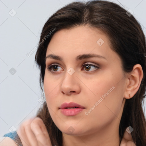 Neutral white young-adult female with medium  brown hair and brown eyes