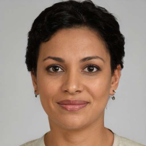 Joyful latino young-adult female with short  brown hair and brown eyes