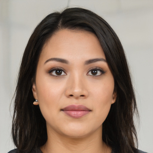 Joyful white young-adult female with long  brown hair and brown eyes