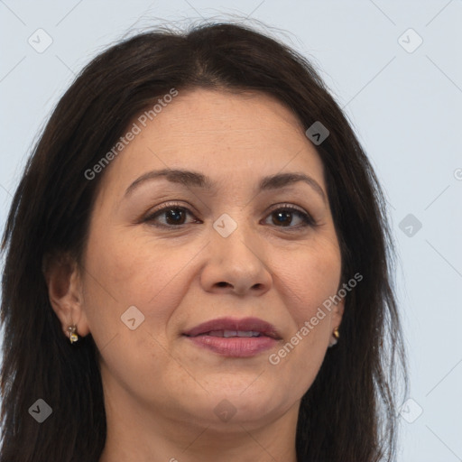 Joyful white adult female with long  brown hair and brown eyes