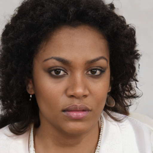 Neutral black young-adult female with long  brown hair and brown eyes