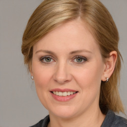 Joyful white young-adult female with medium  brown hair and blue eyes