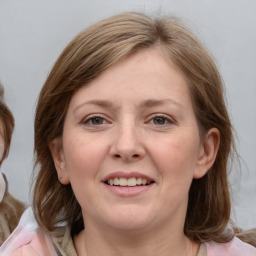 Joyful white young-adult female with medium  brown hair and blue eyes