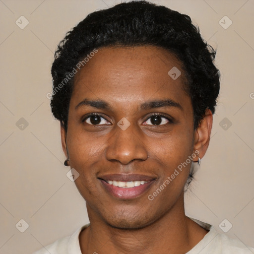 Joyful black young-adult male with short  black hair and brown eyes