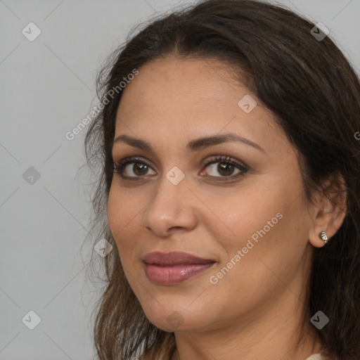 Joyful white young-adult female with long  brown hair and brown eyes