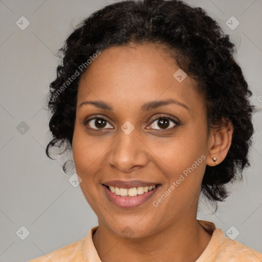 Joyful black young-adult female with medium  brown hair and brown eyes